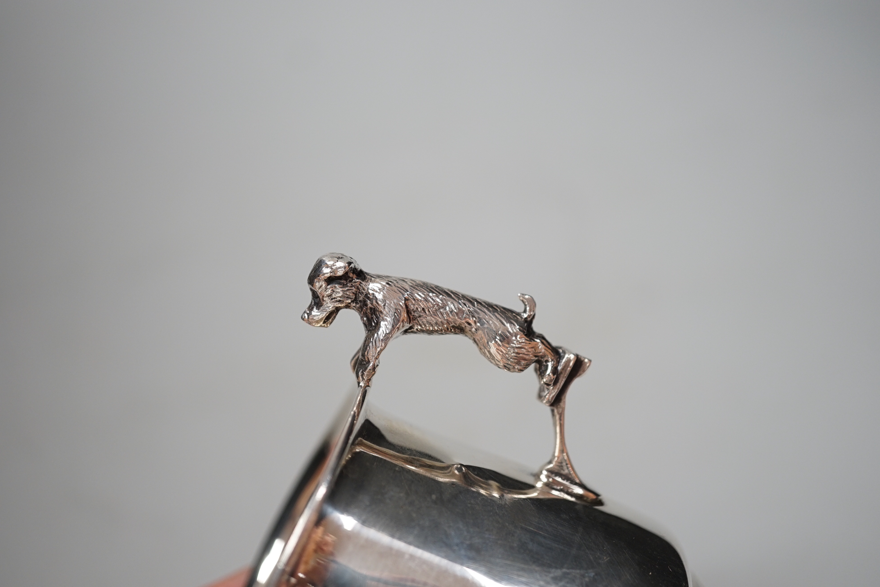 A George V silver christening mug, with dog handle, Sanders & Mackenzie, Birmingham, 1931, 77mm, together with a lady's 9ct gold Vertex manual wind wrist watch, no strap and a Lorus nurses watch.